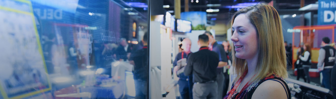 Woman at kiosk at trade show