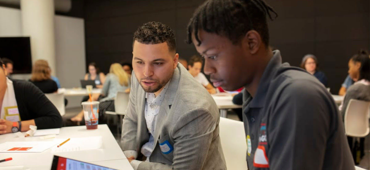 Two young professionals looking at iPad