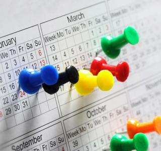 Thumbtacks on calendar