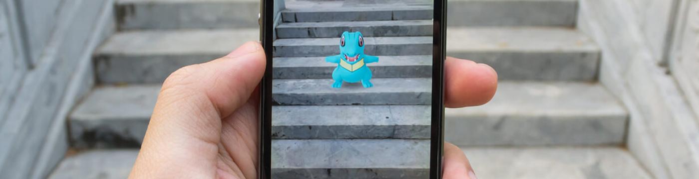A person playing Pokémon Go A person playing Pokémon Go