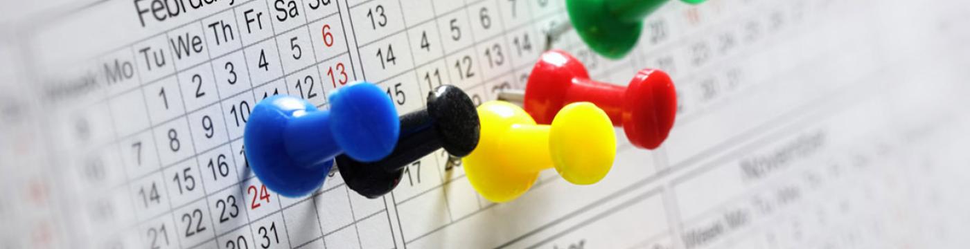 Thumbtacks on calendar Thumbtacks on calendar